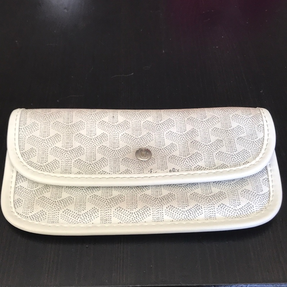 White Goyard wallet pouch.